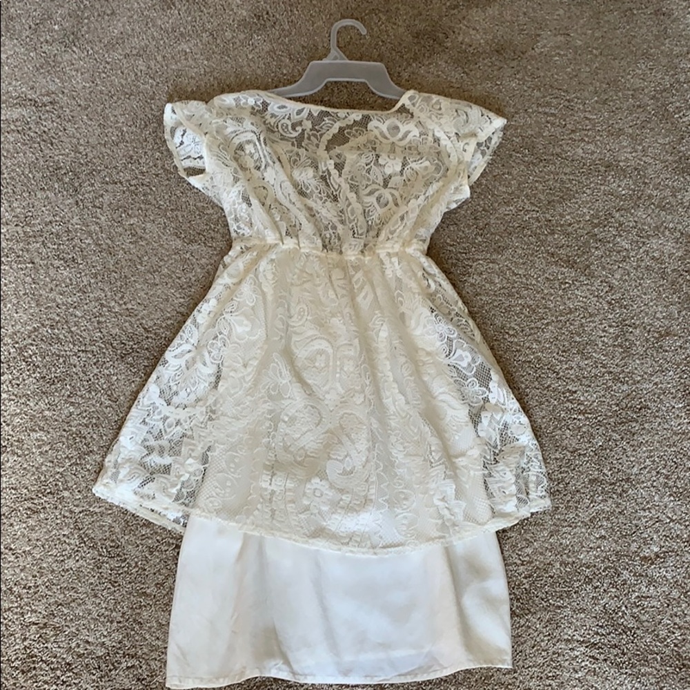 A  creme colored lace dress
